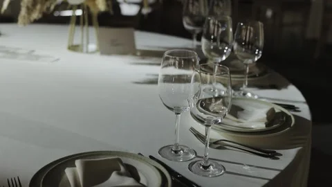 Elegant wedding reception with beautifully arranged tables and wine glasses Stock Footage 306365853
