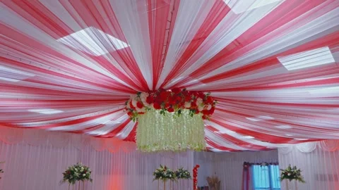 Elegant Wedding Reception Ceiling Decor with Red and White Drapes Stock Footage 340355682