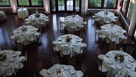 Elegant wedding reception hall with decorated tables Stock Footage 337911035