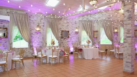 Elegant Wedding Reception Hall Decorated With String Lights and Floral Stock Footage 345095007