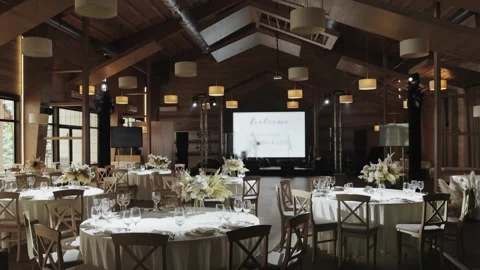 Elegant wedding reception setup in a spacious indoor venue Stock Footage 306365681