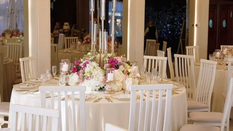 Elegant Wedding Reception Table Decor with Pink and White Floral Centerpieces Stock Footage 346421163