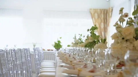 Elegant Wedding Reception Table Decorated with White Flowers and Crystal Stock Footage 343852526