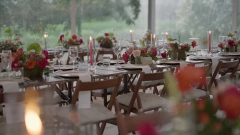 Elegant Wedding Reception Table Setting with Floral Arrangements Stock Footage 337778217