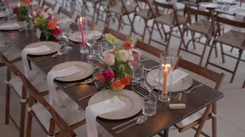 Elegant Wedding Reception Table Setting With Floral Centerpieces And Candles Stock Footage 337778295