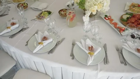 Elegant Wedding Reception Table Setting with Gourmet Appetizers and Floral Decor Stock Footage 343848519