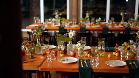 Elegant wedding reception table setting with flower decorations Stock Photos