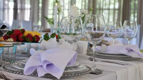 Elegant wedding table arrangement with white napkins Stock Footage 340292619