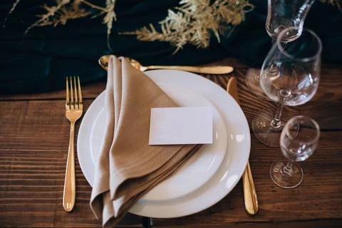 Elegant wedding table set for dinner on wooden table. Stock Photos