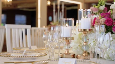 Elegant Wedding Table Setting with Candles and Floral Centerpiece Close-Up 스톡 동영상 345094828
