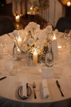 Elegant Wedding Table Setting with Candles and Flowers Stock Photos