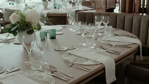 Elegant Wedding Table Setting With Crystal Glasses and White Roses Stock Footage 344013448