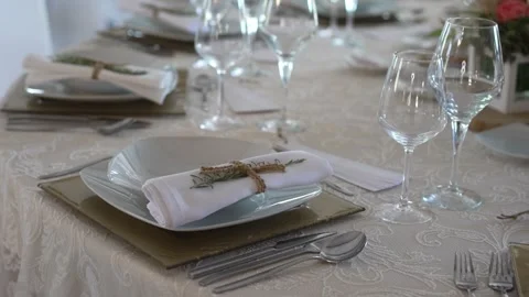 Elegant wedding table setting with folded napkin and glassware Stock Footage 331359395
