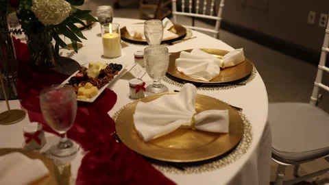 Elegant wedding table setting with gold plates Stock Footage 337589492