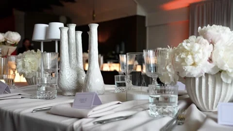 Elegant Wedding Table Setting With White Florals and Crystal Glassware Stock Footage 339044751