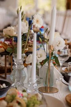 Elegant Wedding Table Setting with White Flowers and Candles. Rustic Wood T.. Stock Photos