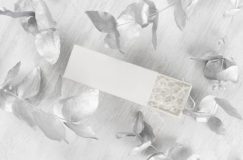 Elegant white blank open rectangle gift box with paper filler mock up on wood Stock Photos