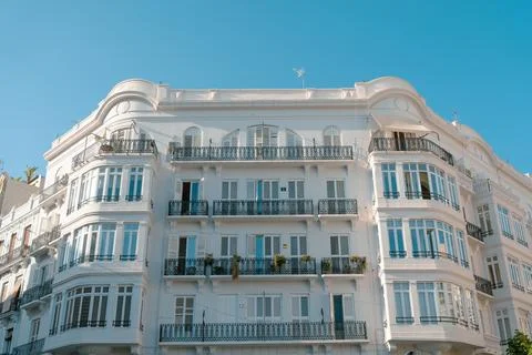 Elegant White Building with Balconies Stock Photos