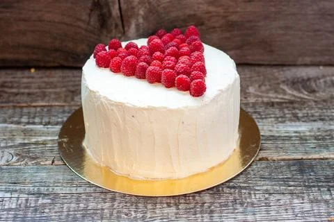 Elegant white cake with raspberry heart for St. Valentine's Day, Mother's D.. Stock Photos