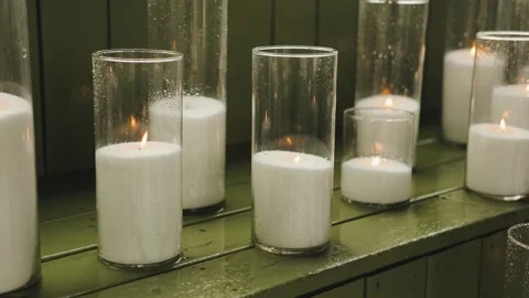 Elegant White Candles elegantly presented in Glass Holders for a touch of Stock Footage 318065833