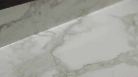 Elegant white marble surface with subtle and exquisite veining patterns. Camera Stock Footage 311252562