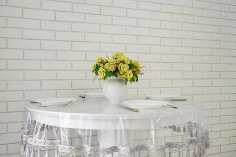 Elegant white round dining table in modern kitchen interior Stock Photos