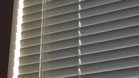 Elegant Window Blinds with Sunlight Filtering Through Stock Footage 263928958