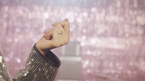 Elegant Woman's Hand in a Sequin Jacket Dancing at a Glamorous Party Stock Footage 311981738