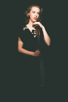 Elegant young female cellist Stock Photos