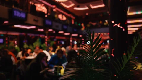 An elegantly Blurred Interior of a Casino featuring Ambiencerich Lighting and a Video stock 315961816