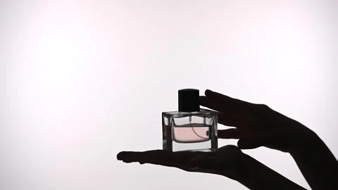 Elegantly Capturing the Essence of Perfume in Silhouette Stock Footage 313525862