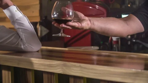 Elegantly placing a drink in front of a guest Stock Footage 112200370