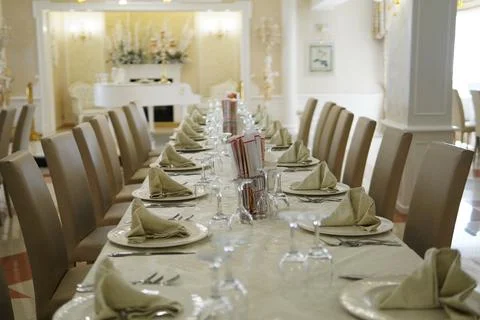 An elegantly set dining table at a formal banquet. Stock Photos