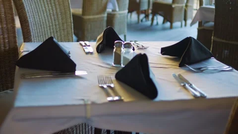 Elegantly set table in a fine dining restaurant in 4k slow motion 120fps Stock Footage 282980820