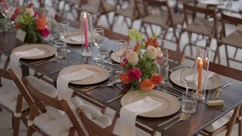 Elegantly Set Wedding Reception Table with Floral Centerpieces Stock-Footage 337778329