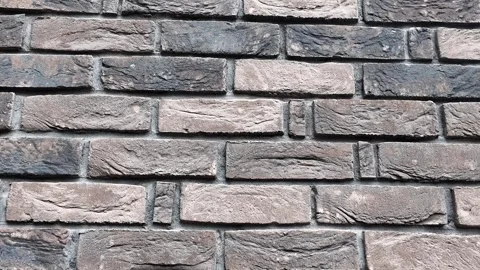 Element of a building wall covered with gray facing brick Video stock 304881481