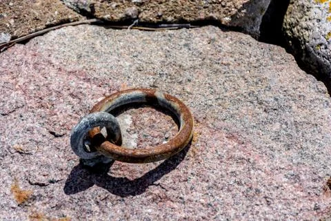 Element of the chain in stone shore Stock Photos