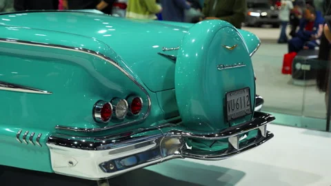 Element of Classic 1958 Chevrolet Impala convertible displayed at an auto show Stock Footage 330987886