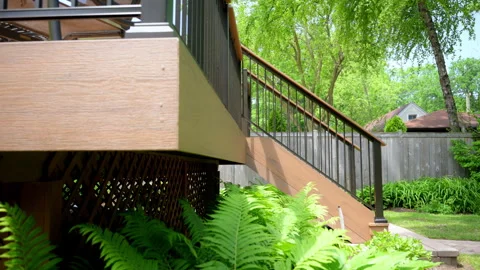 Element of the exterior, new deck with stairs on the backyard , slow move wide Stock Footage 311495757
