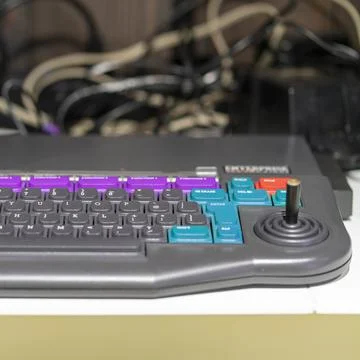 Element of an old and obsolete computer. Keyboard with joystick. Stock Photos