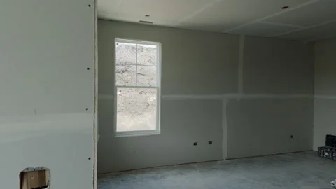Element of Unfinished interior room in a new residential house with drywall Stock Footage 335961602