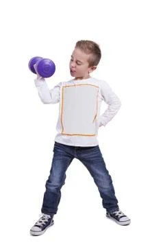 Elementary boy exercising with dumbbell Stock Photos