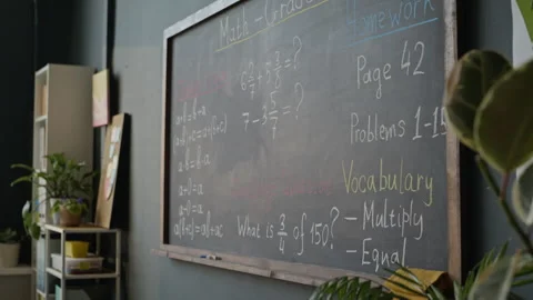 Elementary Math Lesson Written on Blackboard in Classroom Stock Footage 340547739