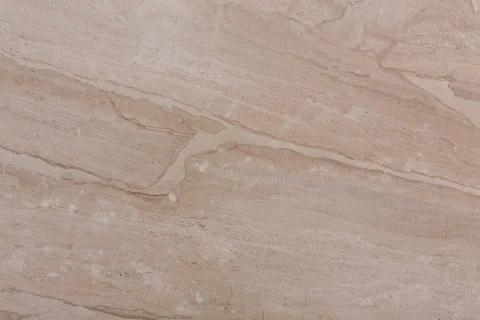 Elementary natural marble texture in beige tone. Stock Photos
