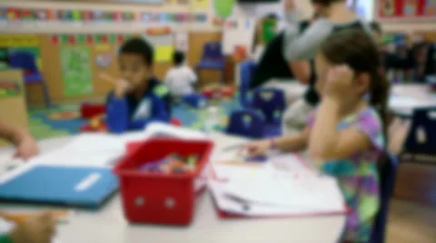 Elementary school-aged children working at tables (1 of 4) Stock Footage 32302185