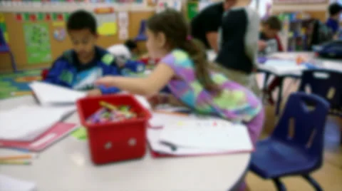 Elementary school-aged children working at tables (2 of 4) Stock Footage 32302188