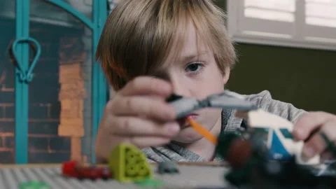 Elementary School Boy Playing with Lego Blocks at Home Stock Footage 230337559