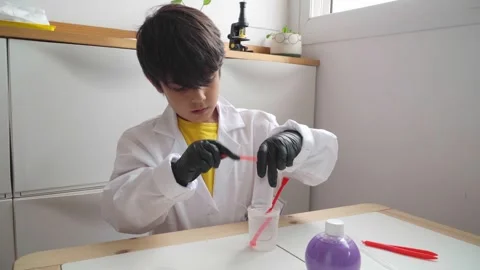 Elementary school boy playing sciences Stock Footage 280684874