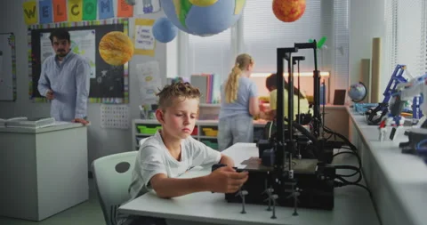 Elementary School Boy Using 3D Printer Control Panel, Learning Automated 3D Stock Footage 314776509