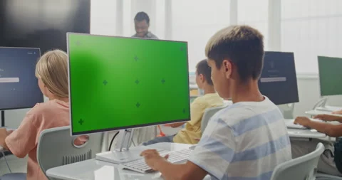 Elementary School Boy Using Computer with Green Screen Mockup During Digital Art Stock Footage 316293154